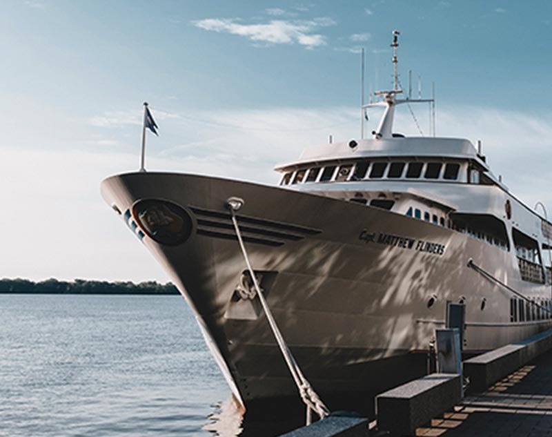 Career in the superyacht industry. Powerboat moored up in a marina.
