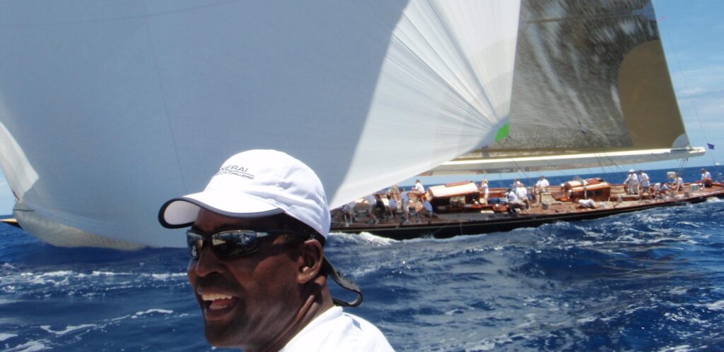 Superyacht crew racing in Antigua Classics with Valsheda in the background