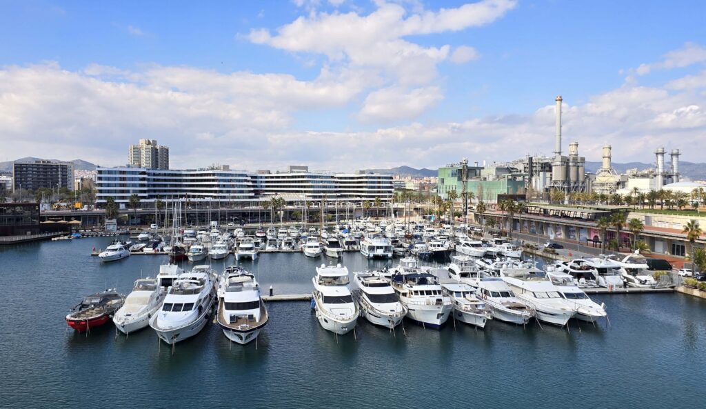 A marina with lots of powerboats moored up.